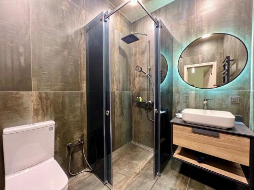 a bathroom with a toilet and a sink and a mirror at Rancho by HV in Sevan