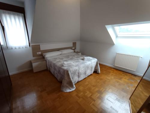 Katil atau katil-katil dalam bilik di Apartamento Moni