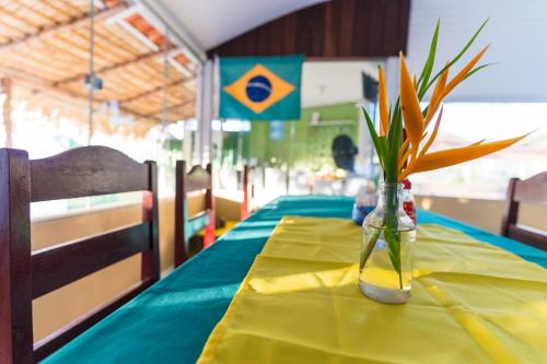 Postel nebo postele na pokoji v ubytování Hotel Coração Verde