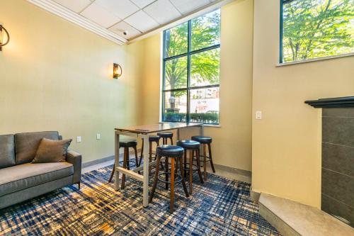 a living room with a couch and a table at Grand Park Hotel & Suites Downtown Vancouver, an Ascend Collection Hotel in Vancouver