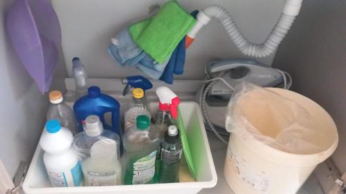 a refrigerator filled with bottles of water and other items at La Terrazza Solarium, in pieno centro 60m dalla stazione ferroviaria 700m dal mare in Santa Flavia