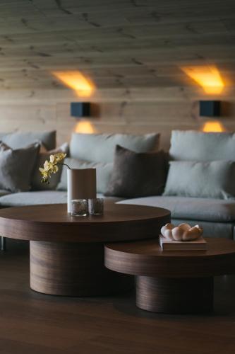 a living room with a couch and a table at Steam Pier Adventure Hotel in Kvaløya