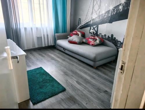 a room with a bed with two pillows on it at 3 istabu dzīvoklis in Preiļi