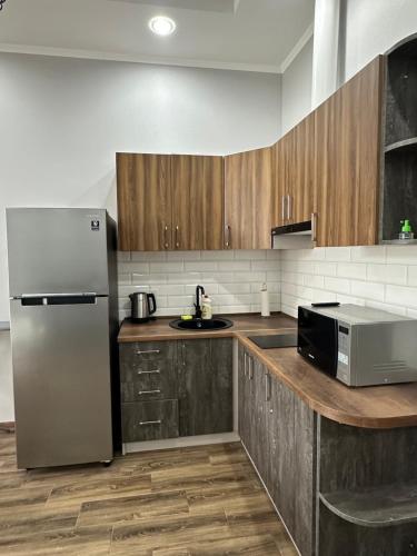 Η κουζίνα ή μικρή κουζίνα στο MAGNIT Apartments у самого моря