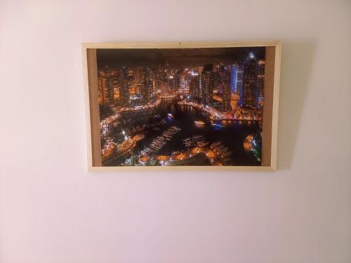 a painting of a city skyline on a wall at Sam's View City Heart Tripoli - Beautiful Apartment With Backyard in Tripolis