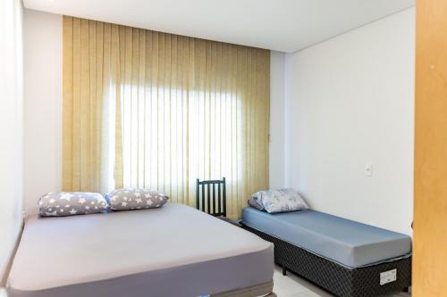 Ένα ή περισσότερα κρεβάτια σε δωμάτιο στο Casa próx às 3 fronteiras e a 20min das Cataratas