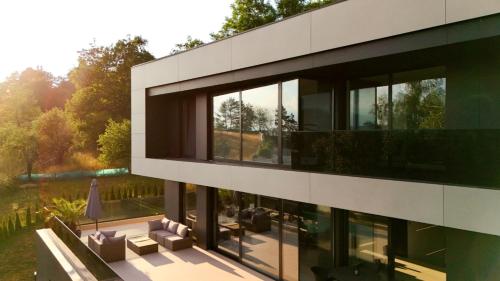 an external view of a building with windows at The Villa O in Sarajevo