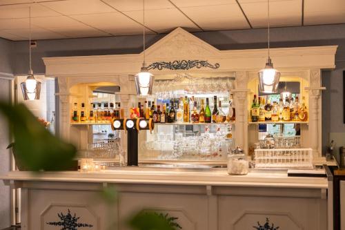 a bar with a lot of bottles of alcohol at Hotel Jans in Rijs