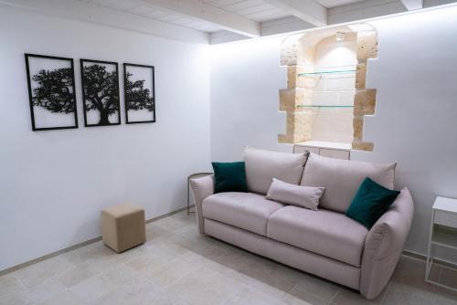 a living room with a couch and a window at EvoAntico1900 in Santeramo in Colle