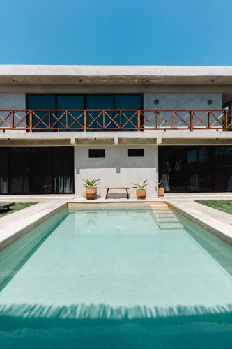 a swimming pool in front of a house at Casa Re Valladolid in Valladolid