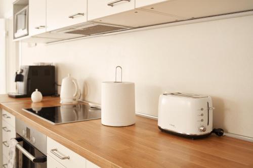 a toaster sitting on a counter in a kitchen at Beachfront apartment in Jūrmala