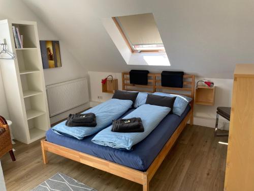 a bedroom with a bed with two bags on it at Ferienwohnung Woldemar in Detmold