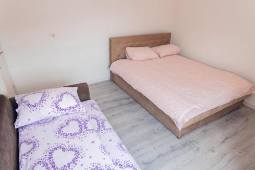 Postel nebo postele na pokoji v ubytování Apartman Marina