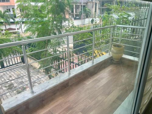 a balcony with a metal railing and a barrel at Nice Apartment Great Location!!! in Accra