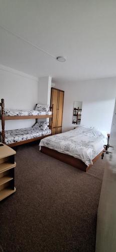 Postel nebo postele na pokoji v ubytování Ambient