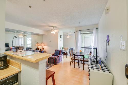 a kitchen and a living room with a kitchen and a living room at 3 Mi to Dtwn Fort Worth! Condo with Hot Tub and Pool in Fort Worth