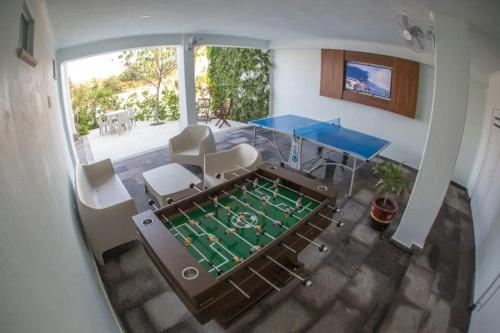 an aerial view of a ping pong table in a house at Palmar & master suite in Bajos de Chila