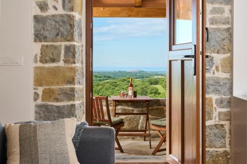 a view from a room with a table and a window at Casa Minalu in Marušići