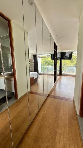 a living room with a large glass wall at Suite Chachani in Arequipa