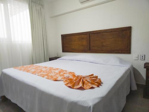 Llit o llits en una habitació de Departamento Caracol