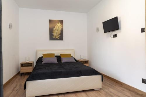 Ένα ή περισσότερα κρεβάτια σε δωμάτιο στο M&K Apartament Stronie Śląskie