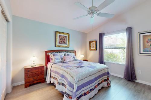 a bedroom with a bed and a ceiling fan at Smith and Davis Retreat in The Villages