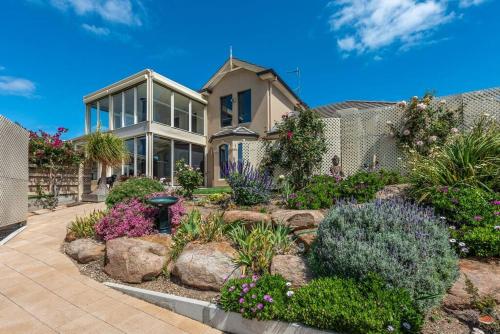a house with a garden in front of it at Ludere Normanville in Normanville