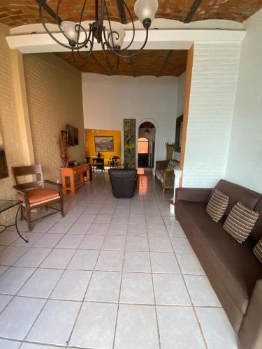 a large living room with a couch and chairs at Hotel Villas Ajijic, Ajijic Chapala Jalisco in Ajijic