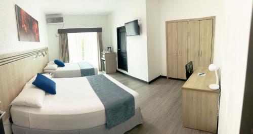 Postel nebo postele na pokoji v ubytování Hotel Mar Azul