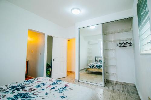 a bedroom with a large mirror and a bed at Entire Vacation Home in San Juan - Fits 10 in San Juan