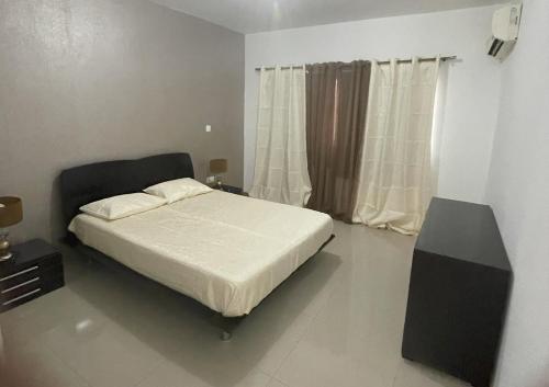 Postel nebo postele na pokoji v ubytování Meraki's Apartment