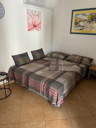 a bedroom with a twin bed and a table at Apartments with parking space Metajna, Pag - 4127 in Zubovići