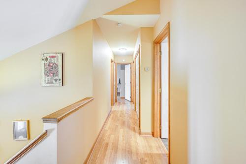 a hallway with white walls and wooden floors at Pool, Yard and Game Room Family Home in Kunkletown in Effort