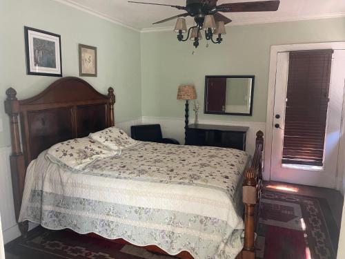 a bedroom with a bed and a ceiling fan at Guerneville Lodge in Guerneville
