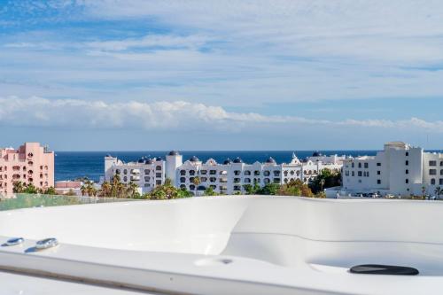 a view of the city from the balcony of a building at New Penthouse in Medano with Jacuzzi and Terrace in Cabo San Lucas