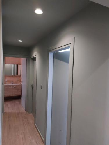 a hallway with a sliding glass door in a room at My Nafpaktos Resort in Nafpaktos