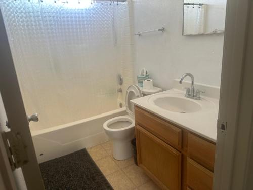 a bathroom with a sink and a toilet and a shower at Hotel house in El Paso