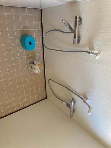 a bathroom with a sink and a toilet at Yoshidoku Inn - Universal Studios 3 stops, Namba 2 stops, Shinsaibashi 3 stops in Osaka