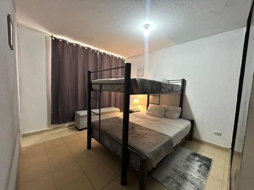a bedroom with two bunk beds in a room at Loft Sipeh Xalapa Departamento 4 in Xalapa