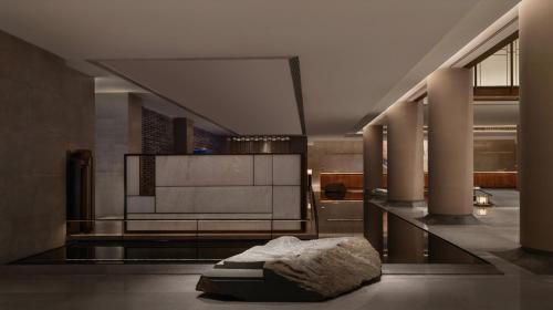 a room with columns and a sculpture on the floor at Narada Grand Hotel Zhejiang in Hangzhou