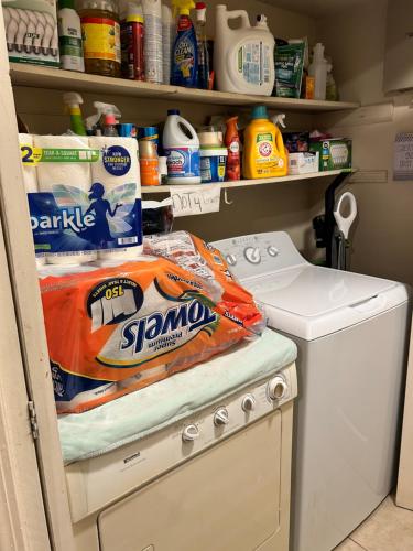 a refrigerator filled with a package of cleaning supplies at Beautiful Living Area in Montgomery