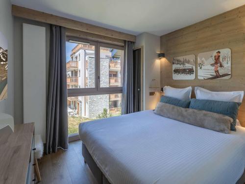 Katil atau katil-katil dalam bilik di Appartement 8 pers, centre Courchevel, accès pistes, SPA, idéal familles - FR-1-631-203