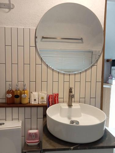 a bathroom with a sink and a mirror at Sky The Campers in Chiang Dao