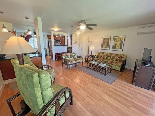 a living room with couches chairs and a television at Pono Kai Resort #A101 - A Welcoming 2 Bdrm - 2 Bath, Private Beachfront Vacation Home in Kapaa