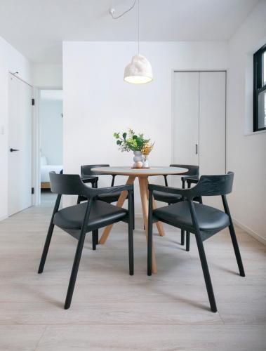 a dining room with a table and chairs at pufuka Higashi Mukojima 4 in Tokyo