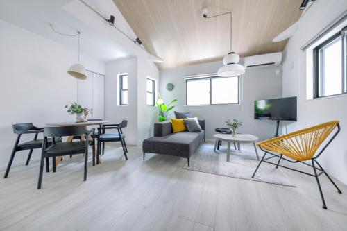 a living room with a table and a dining room at pufuka Higashi Mukojima 4 in Tokyo