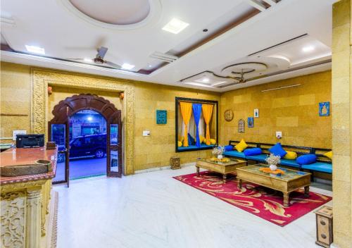 a living room with a couch and a table at Hotel Meerana in Jaisalmer