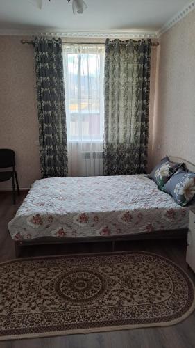 Postel nebo postele na pokoji v ubytování Ainur