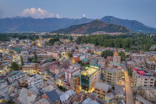 an aerial view of a city at night at Eternity By Greenscape in Srinagar