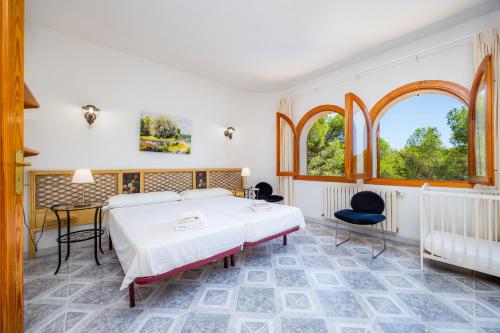 Ένα ή περισσότερα κρεβάτια σε δωμάτιο στο Ca Ses Mestres
